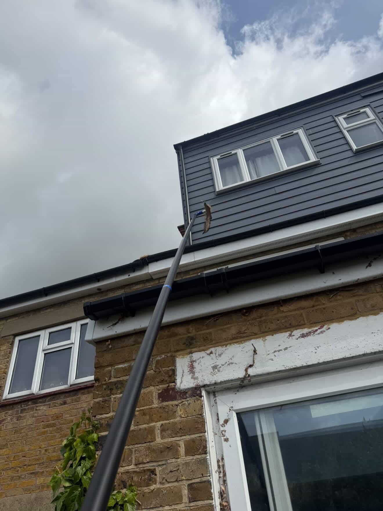 External building cleaning work on residential home facade