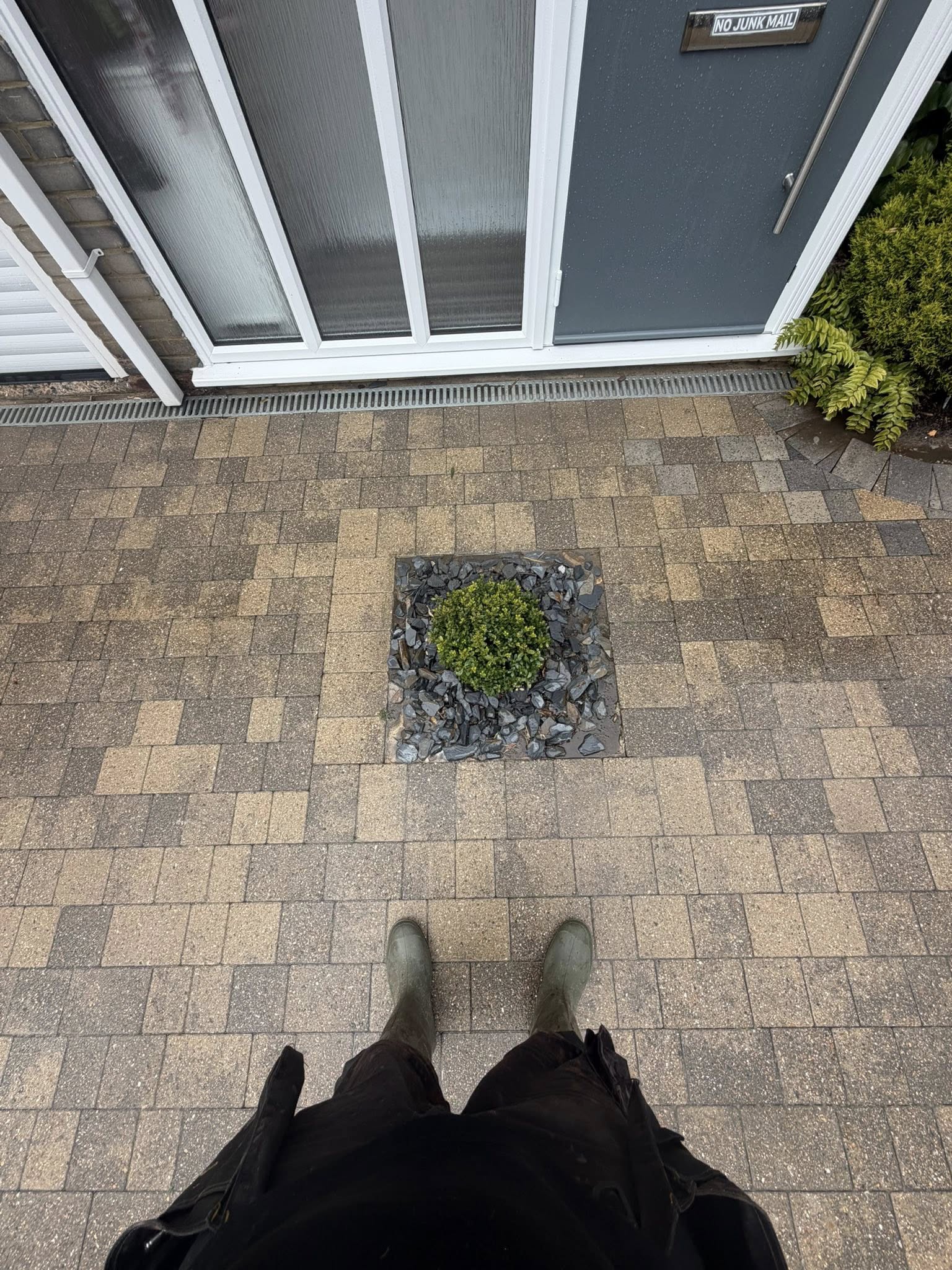 Patio driveway with central planted feature area